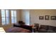 Comfortable bedroom with window shutters, side table, and cozy seating area at 15861 W Westview Dr, Goodyear, AZ 85395