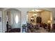 Inviting dining room featuring chandelier, a china cabinet and formal seating at 15861 W Westview Dr, Goodyear, AZ 85395
