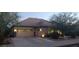 Well-maintained single-story home with a spacious garage and manicured front lawn at 15861 W Westview Dr, Goodyear, AZ 85395