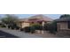 Charming single-story home with a stone arched entryway and meticulously landscaped front yard at 15861 W Westview Dr, Goodyear, AZ 85395
