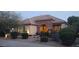 Inviting single-story home featuring a stone archway and well-maintained landscaping at 15861 W Westview Dr, Goodyear, AZ 85395