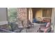 Covered front porch features comfortable seating and decorative elements at 15861 W Westview Dr, Goodyear, AZ 85395