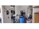 Garage featuring water heater, utility sink, and water filtration system at 15861 W Westview Dr, Goodyear, AZ 85395