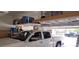 Well-organized garage with shelving and truck at 15861 W Westview Dr, Goodyear, AZ 85395