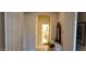 Hallway view with arched doorway and decor at 15861 W Westview Dr, Goodyear, AZ 85395