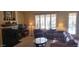 Living area featuring a fireplace and built in features at 15861 W Westview Dr, Goodyear, AZ 85395