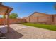 A spacious backyard with artificial grass, rock landscaping, and a covered patio, perfect for outdoor entertaining at 16626 N 20Th St, Phoenix, AZ 85022