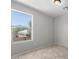 Neutral bedroom with tile floor and large window providing ample natural light at 16626 N 20Th St, Phoenix, AZ 85022