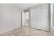 Neutral bedroom featuring tile floor, closet, and entry to another room at 16626 N 20Th St, Phoenix, AZ 85022