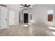 Bright and airy living room with vaulted ceiling, tiled floor and a modern ceiling fan at 16626 N 20Th St, Phoenix, AZ 85022