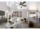 Bright living room features neutral walls, ceiling fan, natural light, and comfortable furnishings at 16626 N 20Th St, Phoenix, AZ 85022