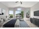 Bright primary bedroom with vaulted ceilings, multiple windows and light-toned furniture and decor at 16626 N 20Th St, Phoenix, AZ 85022