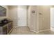 Light and airy entryway with tile flooring, white doors, and neutral paint at 17009 W Eureka Springs Dr, Surprise, AZ 85387