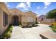 A well-kept home featuring a tile roof, secure front door and meticulous desert landscaping at 17009 W Eureka Springs Dr, Surprise, AZ 85387