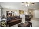 Open-concept living room flowing into the dining area and kitchen at 17009 W Eureka Springs Dr, Surprise, AZ 85387