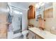 Bright bathroom featuring a shower-tub combination, a toilet, and a vanity with storage at 17200 W Bell Rd # 2162, Surprise, AZ 85374
