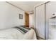 Cozy bedroom featuring a small bed, a closet, and a dresser in a clean, well-lit space at 17200 W Bell Rd # 2162, Surprise, AZ 85374
