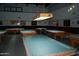 A well-appointed billiard room with multiple tables, perfect for a friendly game with neighbors at 17200 W Bell Rd # 2162, Surprise, AZ 85374