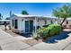 Charming home exterior with a covered patio and well-maintained landscaping at 17200 W Bell Rd # 2162, Surprise, AZ 85374