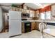 Well-lit kitchen with appliances, cabinetry, and ample countertop space at 17200 W Bell Rd # 2162, Surprise, AZ 85374