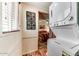 Convenient laundry area with a stacked washer and dryer and decorative wall art at 17200 W Bell Rd # 2162, Surprise, AZ 85374