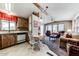 Open-concept living room and kitchen area with cozy seating and natural light at 17200 W Bell Rd # 2162, Surprise, AZ 85374