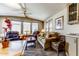 Cozy living room featuring comfortable seating and ample natural light from the windows at 17200 W Bell Rd # 2162, Surprise, AZ 85374