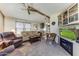 Inviting living room with plush seating, a fireplace, and a view into the kitchen at 17200 W Bell Rd # 2162, Surprise, AZ 85374