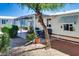 Cozy patio with brick pavers and gravel landscaping, offering a charming outdoor retreat at 17200 W Bell Rd # 2162, Surprise, AZ 85374