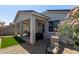 Backyard patio with grill and seating area at 17338 W Via De Luna Dr, Surprise, AZ 85387