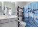 Bathroom featuring a gray vanity and dolphin shower curtain at 17338 W Via De Luna Dr, Surprise, AZ 85387
