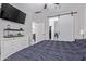 Well-lit bedroom with en-suite and barn door at 17338 W Via De Luna Dr, Surprise, AZ 85387