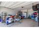 Garage cluttered with storage and recreational items at 17338 W Via De Luna Dr, Surprise, AZ 85387