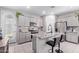 Modern kitchen features stainless steel appliances, granite countertops, and pantry at 17338 W Via De Luna Dr, Surprise, AZ 85387