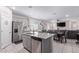 Bright kitchen features a kitchen island, stainless steel appliances, and plenty of storage at 17338 W Via De Luna Dr, Surprise, AZ 85387