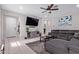 Spacious living room with tile floors, ceiling fan, and comfortable seating at 17338 W Via De Luna Dr, Surprise, AZ 85387