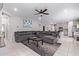 Open-concept living room flowing into kitchen, perfect for entertaining at 17338 W Via De Luna Dr, Surprise, AZ 85387