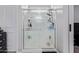 Clean shower stall with built in shelves and modern fixtures at 17338 W Via De Luna Dr, Surprise, AZ 85387
