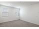 Cozy bedroom features plush carpet, and windows, providing a relaxing retreat at 17746 W Turquoise Ave, Waddell, AZ 85355