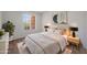 This bright bedroom features a large window and modern decor at 17910 N 92Nd Ln, Peoria, AZ 85382