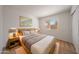 This bright bedroom has a large window and two nightstands at 17910 N 92Nd Ln, Peoria, AZ 85382