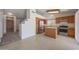 Spacious kitchen features stainless steel appliances, wooden cabinets, and ample counter space perfect for cooking at 17910 N 92Nd Ln, Peoria, AZ 85382