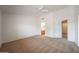 Spacious primary bedroom featuring neutral carpet and an ensuite bathroom with a bright, airy feel at 17910 N 92Nd Ln, Peoria, AZ 85382