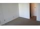 Neutral carpeted bedroom with simple white walls and baseboards, showcasing electrical outlets at 1825 W Ray Rd # 1008, Chandler, AZ 85224