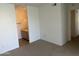 Bedroom featuring neutral carpet and a view into the bathroom at 1825 W Ray Rd # 1008, Chandler, AZ 85224