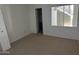 Bedroom featuring neutral carpet, an open closet door, and natural light at 1825 W Ray Rd # 1008, Chandler, AZ 85224