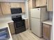 Bright kitchen featuring stainless steel appliances, wood cabinets, and tile floors at 1825 W Ray Rd # 1008, Chandler, AZ 85224