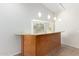 Open bar area with counter seating and pendant lighting at 19206 N 40Th St, Phoenix, AZ 85050