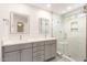 Modern bathroom with double vanity, frameless shower and tile surround at 19206 N 40Th St, Phoenix, AZ 85050