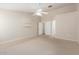 Large bedroom with a vaulted ceiling, ceiling fan, and neutral walls and carpet provides a serene space at 19206 N 40Th St, Phoenix, AZ 85050